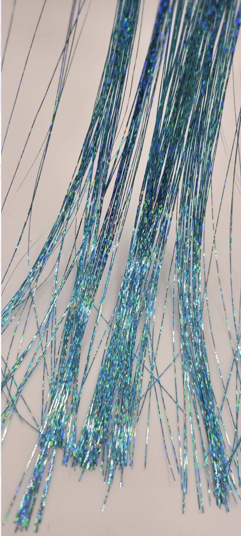 Shiny blue tinsel strands on display.